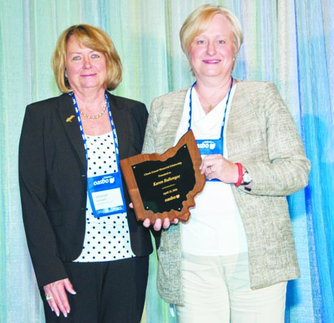 Manchester Local School District Treasurer Karen Ballengee, right, was recently awarded the Chuck Gossett Memorial Scholarship by the Ohio Association of School Business Officials.