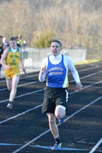Manchester’s Brendon Kessler was the winner of the 200 Meter Dash in a time of 23.93 at Tuesday’s West Union Invitational. Photo by Mark Carpenter - People's Defender