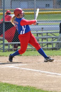Peebles freshman McKenzie Swango takes a big cut during action from the doubleheader with New Boston.