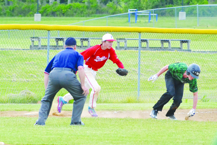 Peebles third baseman Levi Newkirk chases down this Western base runner as the beginning of a crucial seventh inning double play in the Indians’ 5-2 sectional tournament win over Western Latham on May 7. Photo by Mark Carpenter.