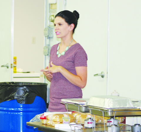 Macy Staggs, one of the members of the start-up committee for the newly formed Adams County Young Ag Professionals, speaks to the audience assembled at the inaugural meeting on June 24.