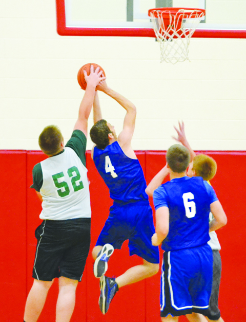 North Adams freshman Austin McCormick rejects this shot as the Green Devils battled Southeastern in last week's Hillsboro Shootout.