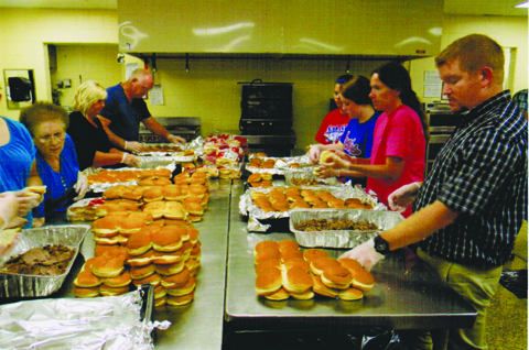 Junior Fair Beef BBQ volunteers helped make over 2,000 sandwiches for the 1,177 people served in 2015.