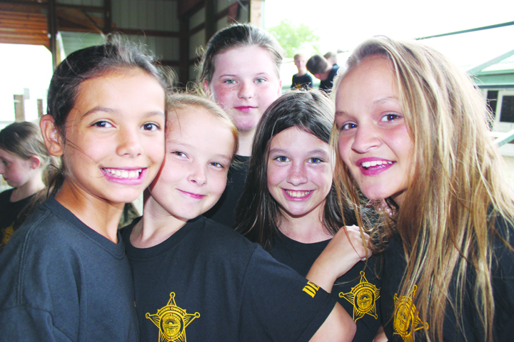 This group of young ladies is all smiles as part of the Adams County Junior Deputy Boot Camp held last weekend in West Union.