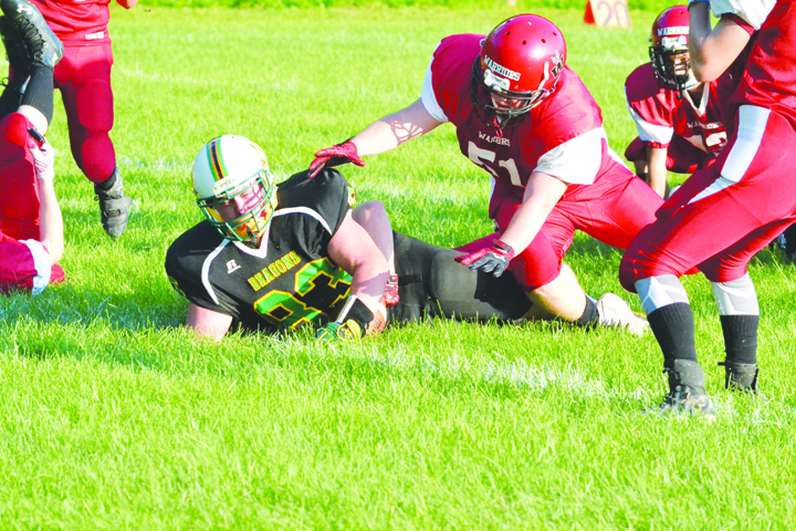West Union’s Jordan Hendricks barely makes it across the goal line on a 10-yard touchdown run that opened the scoring in the Dragons’ 34-0 win over Eastern Brown on Friday night at Freedom Field.