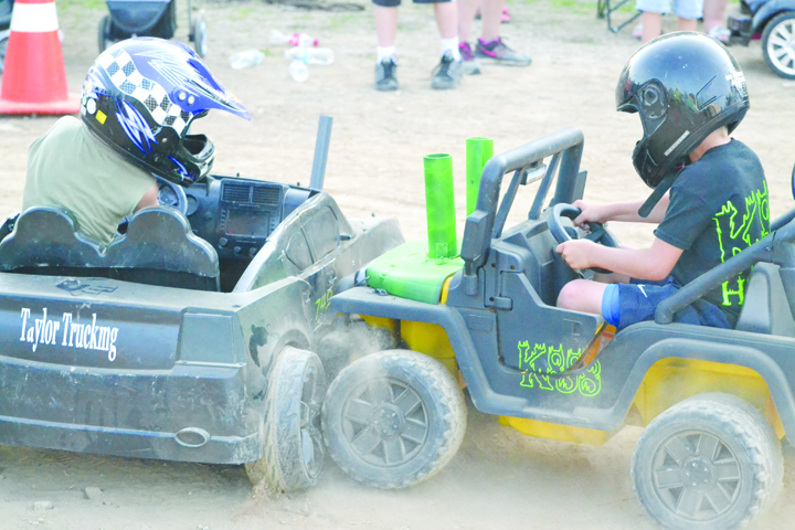These two young men battled to the end in Saturday night’s Power Wheels Derby, with both being declared as first-place winners in the competition. Photo by Mark Carpenter