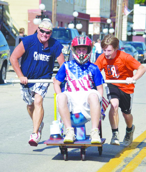 A different kind of race headed down 2nd Street in Manchester on Saturday evening, this one appropriately called “The Toilet Bowl Race.” Photo by Michelle Bilyeu