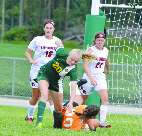 North Adams’ Zeke Acosta, right, gets a touch and sends the ball down field during action from the SHAC Soccer Preview as the Green Devils battled Eastern Brown.