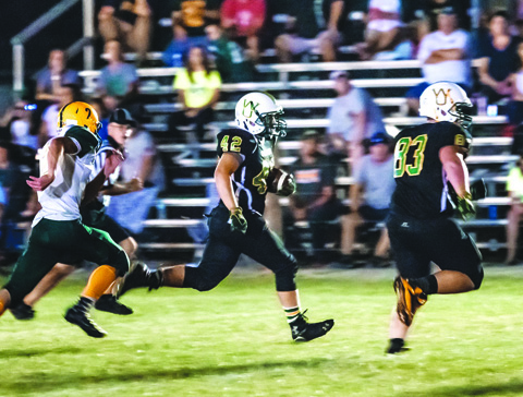 West Union senior running back Chris Silhavy (with ball) was an offensive force in the Dragons’ 51-0 win over North Adams on Friday night, Sept. 9.