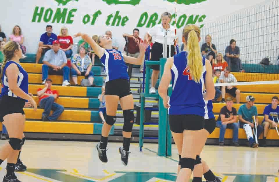 Peebles’ Jessica Johnson, center, goes high for a kill attempt during action from the Lady Indians’ three-set win at West Union last Thursday night.