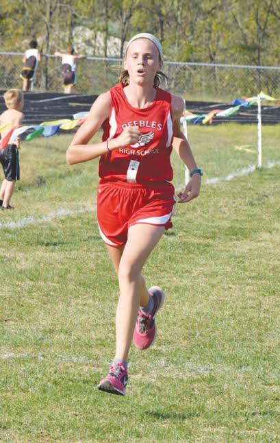 Peebles seventh grader Katy Seas closes in on the finish line on her way to winning the junior high girls race at last week’s West Union Invitational.