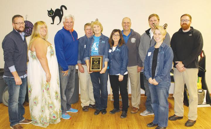 At the annual Humane Society Howl-O-Ween Dinner and Auction, Karen Franklin was honored with the Community Service Award. Pictured here at that presentation are, from left, Ryan Chadwick, Deanna Turner, Ty Pell, Brian Mason, Karen Franklin, Barbara Jones, Brian Baldridge, Paul Worley, Jessica Huxmann, and Todd Mitchell.