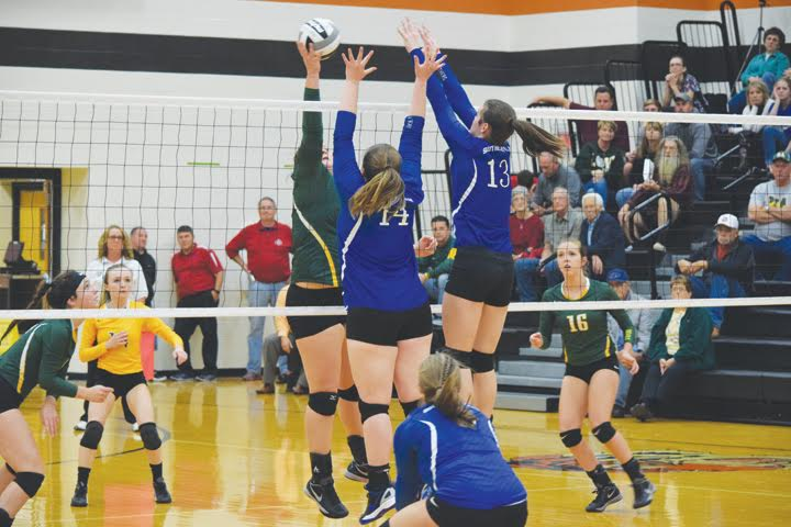 With the size of both teams, there was a lot of action at the net during last week’s district semi-final volleyball match in Waverly. Here, North Adams’ Avery Harper attempts to find an open spot over the outstretched arms of a pair of Southeastern blockers.