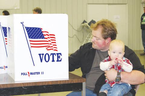 The 2016 election reached all ages as this youngster accompanied his father to the polls on Tuesday at the fairgrounds in West Union.
