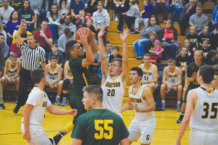 North Adams point guard Isaiah Anderson slices through the Georgetown defense on his way to the basket during action from the Nov. 11 Foundation Game. Anderson racked up 30 points as the Devils slipped past the host G-Men 60-58.