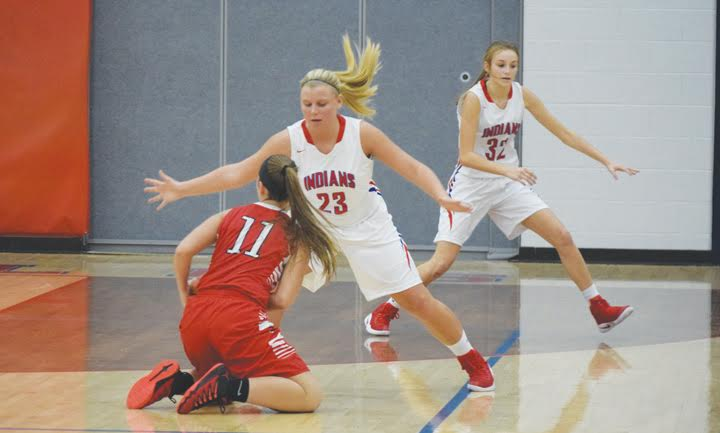 When your defense brings your opponent to their knees, you must be doing a good job as Peebles’ Jessica Sowards (23) here does to Felicity’s Lauren Mitchell (11).