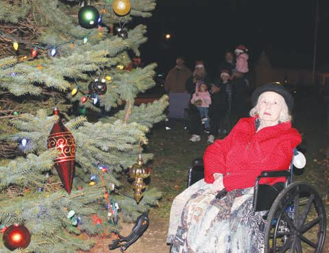 Sharon Malcom, right, and her family handled the duties on Saturday night of lighting the Christmas tree at the Hometown Christmas festivities in Peebles.
