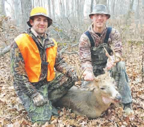 Brothers Patrick and Ben Cross sharing in the rewards of hunting together, are posing with Ben’s 8 point buck taken on opening day during Ohio’s gun season.
