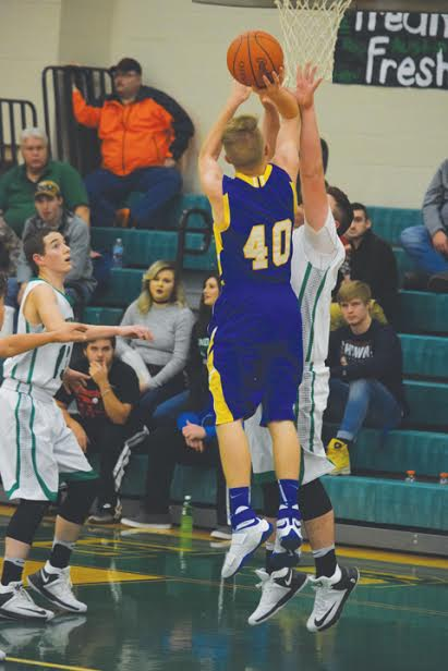 Manchester’s Logan Hanson (40) goes up for a jumper during Friday night’s JV battle at Western Latham. Hanson led the JV Hounds with 12 points as they came home with a 33-13 victory.