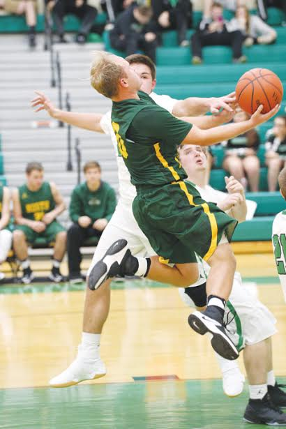North Adams’ Patrick England goes up for a contested shot during Tuesday’s SHAC contest in Fayetteville. England scored 16 points as the Devils came home with a 71-54 victory.