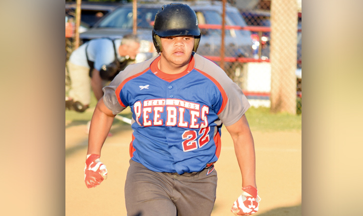 Peebles’ Brennan Kyle races to first base after his game-winning walk-off single in the bottom of the sixth gave his team a 6-5 win over Manchester.
