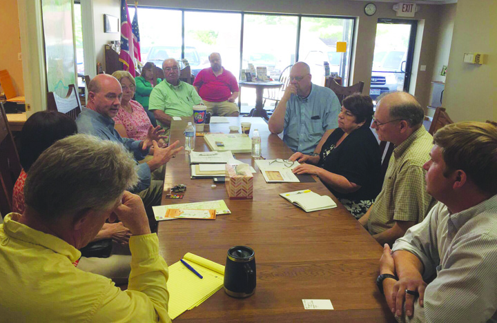Community and organization leaders met with "Raiders on the Ohio" project leader Scott Dockus, center, on June 3 concerning a new documentary being produced about Morgan's Raiders.