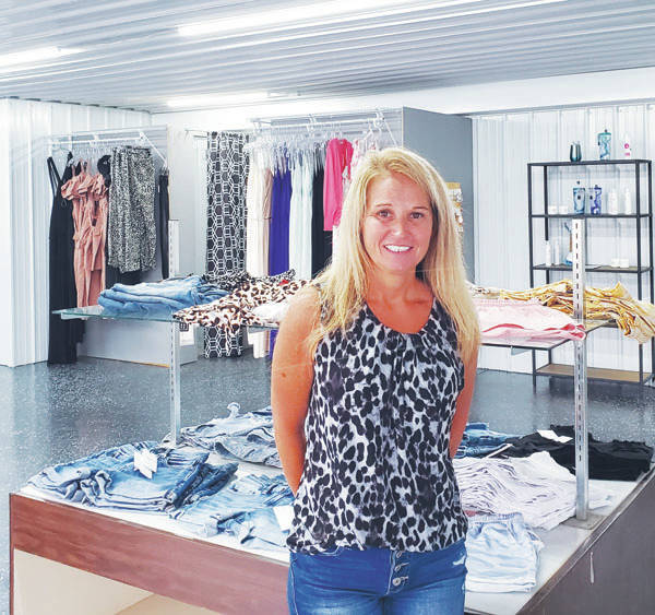 127276438_web1_alfashion
A&L Fashion offers womens, mens and childrens clothing, shoes, accessories, tumblers and assorted beauty products. Pictured here is owner Angie Lafferty. (Photo by Ashley McCarty)