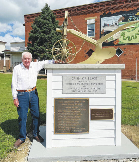 Peebles Mayor Wayne Setty stands beside the Cairn of Peace Monument in downtown Peebles. (Photo by Sherry Larson)