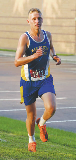 Manchesters Connor Darnell took first place in the high school boys race at the Dog Pack Challenge on September 14. (Photo by Mark Carpenter)