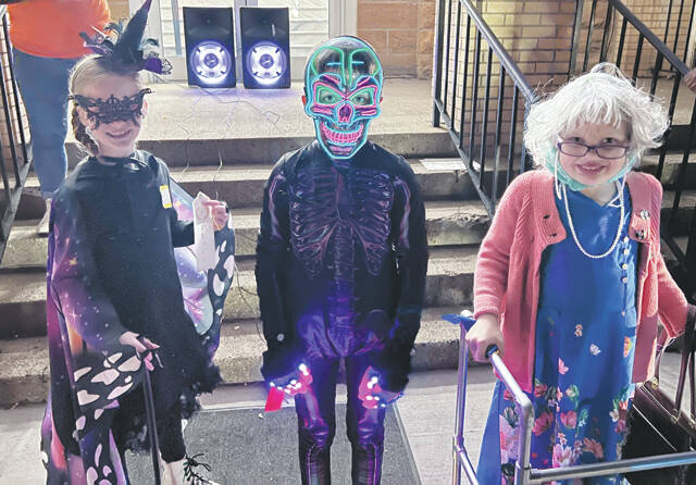 7 - 9 Year-Olds Costume Winners: 1st Place- Katelyn Irvin (Old Lady); Second Place- Landon Collins (Glowing Skeleton); 3rd Place- Serenity Dalton (Witch) (Photo by Sherry Larson)