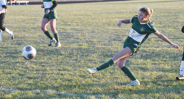With the left foot, North Adams sophomore Raylan Eldridge completes the hat trick with this second half goal in the Lady Devils 8-0 section win over West Union on October 19. (Photo by Mark Carpenter)