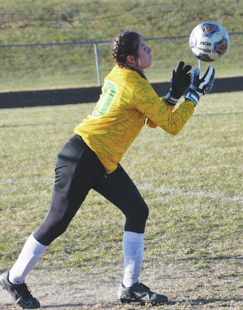 West Union junior goalkeeper Jaylynn Mason hauls in a save during the Lady Dragons season-ending loss to North Adams in the Division III sectional tournament. (Photo by Mark Carpenter)