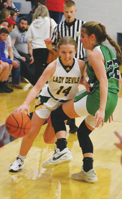 North Adams Kenlie Jones (14) looks for some space to work around the defense of Fayettevilles Anne Murphy in action from the November 11 SHAC Preview. (Photo by Mark Carpenter)