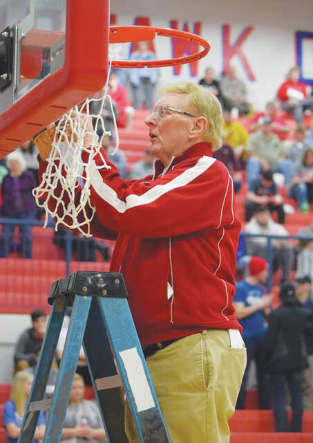 The Peebles community and basketball program mourns the loss of Dayne Woop Woop Puckett, who passed away last week at the age of 82. The Peebles jacket that Puckett is wearing in this photo will be displayed on an empty chair on the Peebles bench this season, according to Indians head Coach Josh Arey. (Photo by Mark Carpenter)