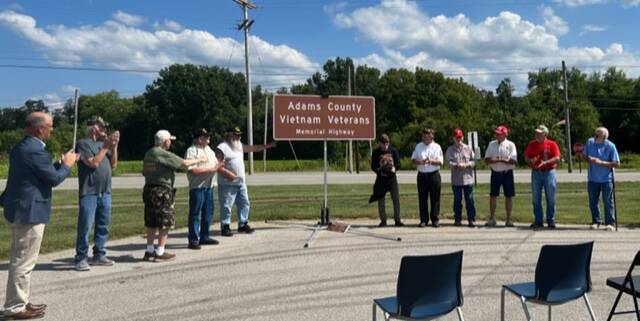Local Vietnam veterans cheer as the new highway sign in Manchester is unveiled. (Photo by Sherry Larson)