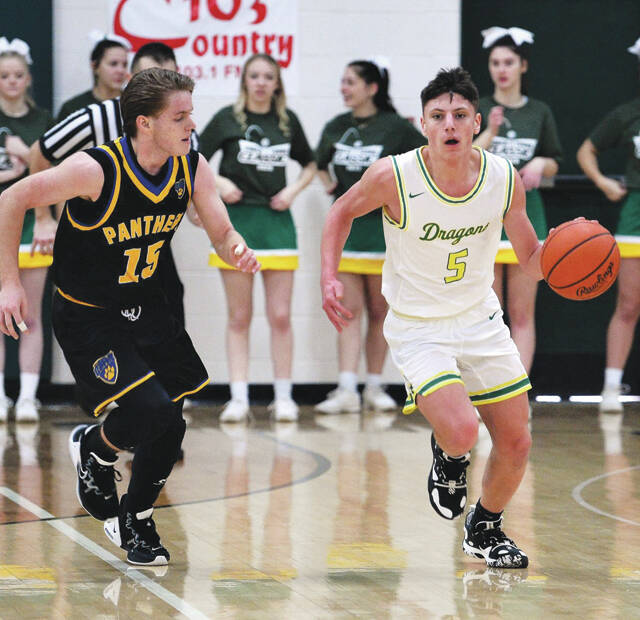 West Union senior Colby Harover (5) had one of his best all-around games of the season with 11 points to help the Dragons get by Portsmouth Clay 54-51. (Photo by Tim Daulton)