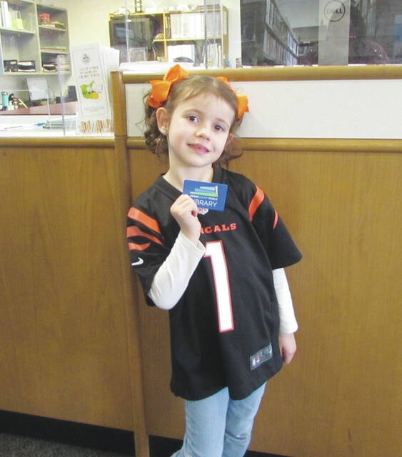 Ariana got a library card and checked out some books at the Manchester Library.