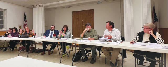 Manchester Village Council, from left, Diane Brown, Gidget Applegate, Christina Henderson, Solicitor Tony Baker, Mayor B.J. Goodwin, Dennis Barnd, Troy Jolly and Regina Adams. (Photo by Sherry Larson)