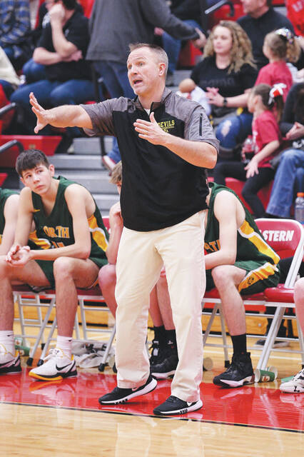 Coach Nathan Copas and his 17-4 North Adams Green Devils are the #4 seed in the Southeast District Division III sectional tournament. (Photo by Tim Daulton)