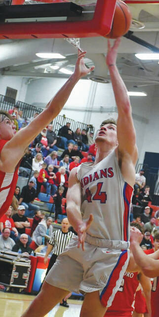 Peebles senior Zane Knechtly goes up for a reverse layup attempt in the second half of the Indians 64-52 win over Hillsboro on February 14. Knechtly scored 9 points in his final regular season home game. (Photo by Mark Carpenter)