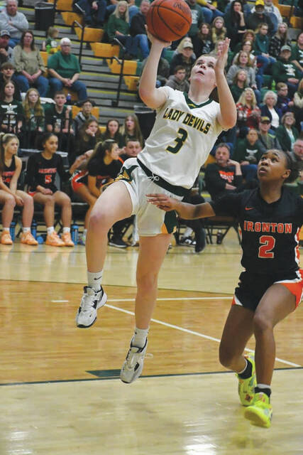 Its a steal and score for North Adams sophomore Tatum Grooms, who provided a spark on both ends of the court as the Lady Devils won a Division III sectional championship with a 50-30 win over Ironton. Grooms scored 10 points in the victory. (Photo by Mark Carpenter)