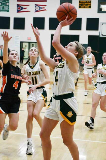 North Adams Kenlie Jones drives for a score in the second half of the Lady Devils 50-30 sectional title game win over Ironton on February 18. Jones tallied 12 points in the win that propelled the Lady Devils back to the Division III district tournament. (Photo by Mark Carpenter)