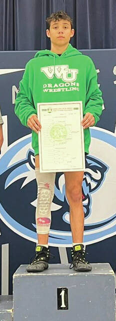 West Unions Ethan Cantrell holds the top spot on the podium after winning the schools first-ever boys sectional wrestling championship. (Photo provided)