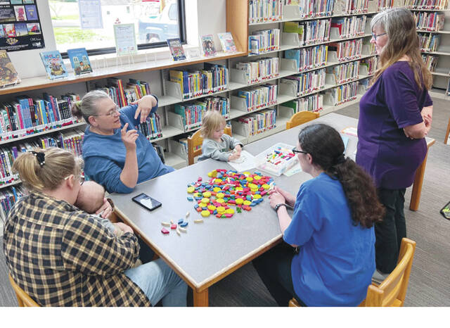 Participants enjoyed coloring sheets, creating designs with shapes, singing songs, and reading One Fish, Two Fish, Red Fish, Blue Fish by Dr. Seuss during Storytime at the West Union Library.
