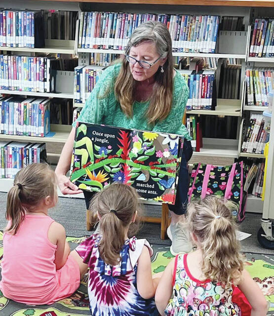 West Union Library Programmer Jani offers fascinating, engaging, and educational Storytimes for preschoolers and families. In this picture, Jani reads Once Upon a Jungle by Laura Knowles and James Boast.