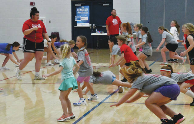 <p>Peebles Lady Indians varsity coach Sidney Pell works with her youth campers on “hustle” drills during her recent basketball camp. (Photo by Mark Carpenter)</p>