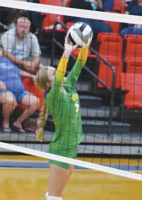 West Union junior setter Ashlah Staten pushes one up to a teammate as the Lady Dragons battled Ripley in SHAC action on Monday, August 21. (Photo by Mark Carpenter)