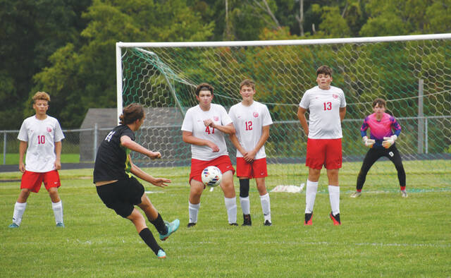This kick by West Unions Arbutus Wuest sailed over the goal but that was a rare occurrence as the Dragons senior racked up nine goals last week in wins over Eastern Brown and Wellston. (Photo by Mark Carpenter)