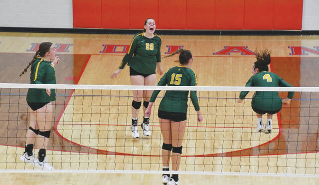 130018293_web1_NA-PHSVB-1
After the final point of the fifth set, the North Adams Lady Devils celebrate their five-set victory over the Peebles Lady Indians on September 28 in Peebles. (Photo by Mark Carpenter)