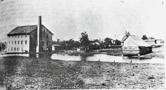 Pictured is a view of the Stroman Mill as it appeared ca. 1900. This shot was taken in the rear of the structure looking southwest. The scenic millpond was a popular place for the boys of the village to fish and loaf in the summer. In winter, it provided the townspeople with a place to ice skate. Large bonfires were built on the banks of the frozen pond and great camaraderie was enjoyed by the villagers each winter for several decades. (Photo courtesy of Valerie Young of West Union)